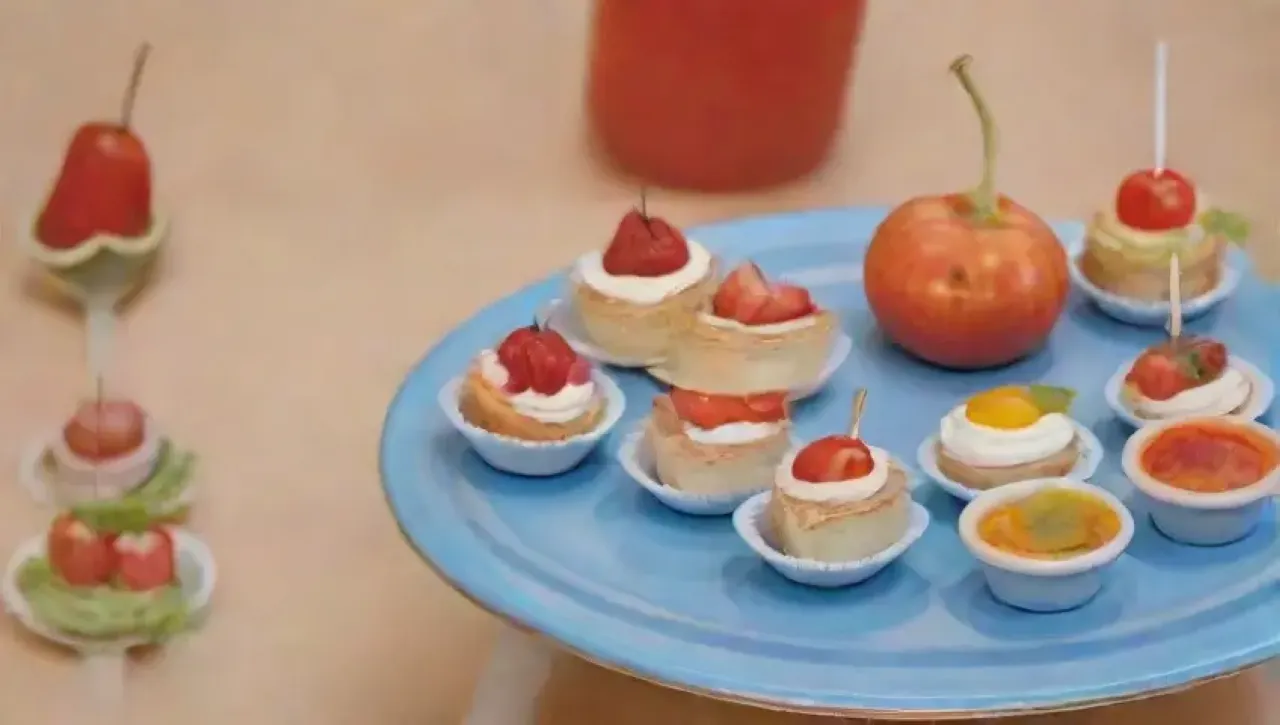 Una mesa colorida y alegre llena de canapés, risas infantiles y un ambiente creativo