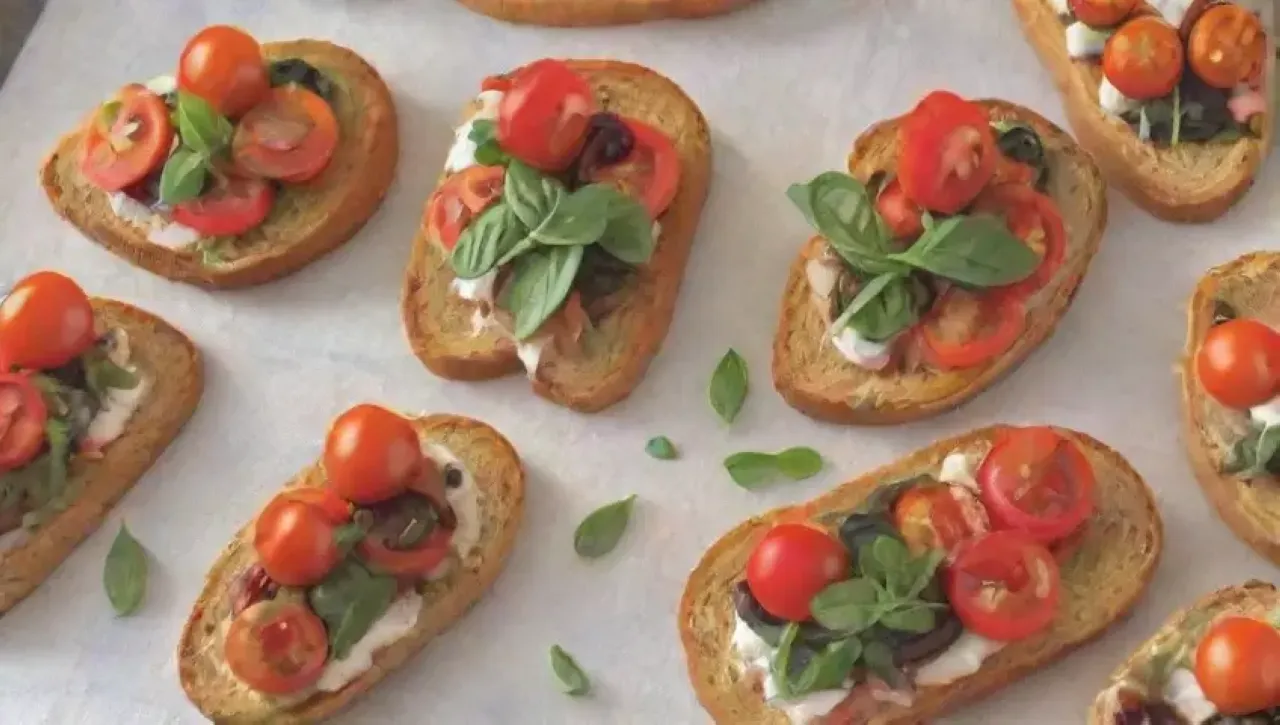 Bruschettas vibrantes con queso, albahaca, tomates y un toque de aceite de oliva